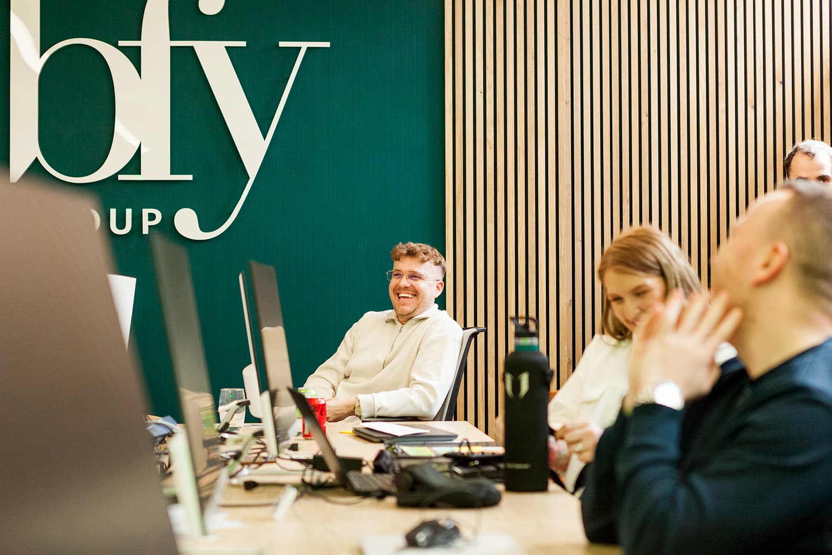 Members of the BFY Group team working in the BFY office.